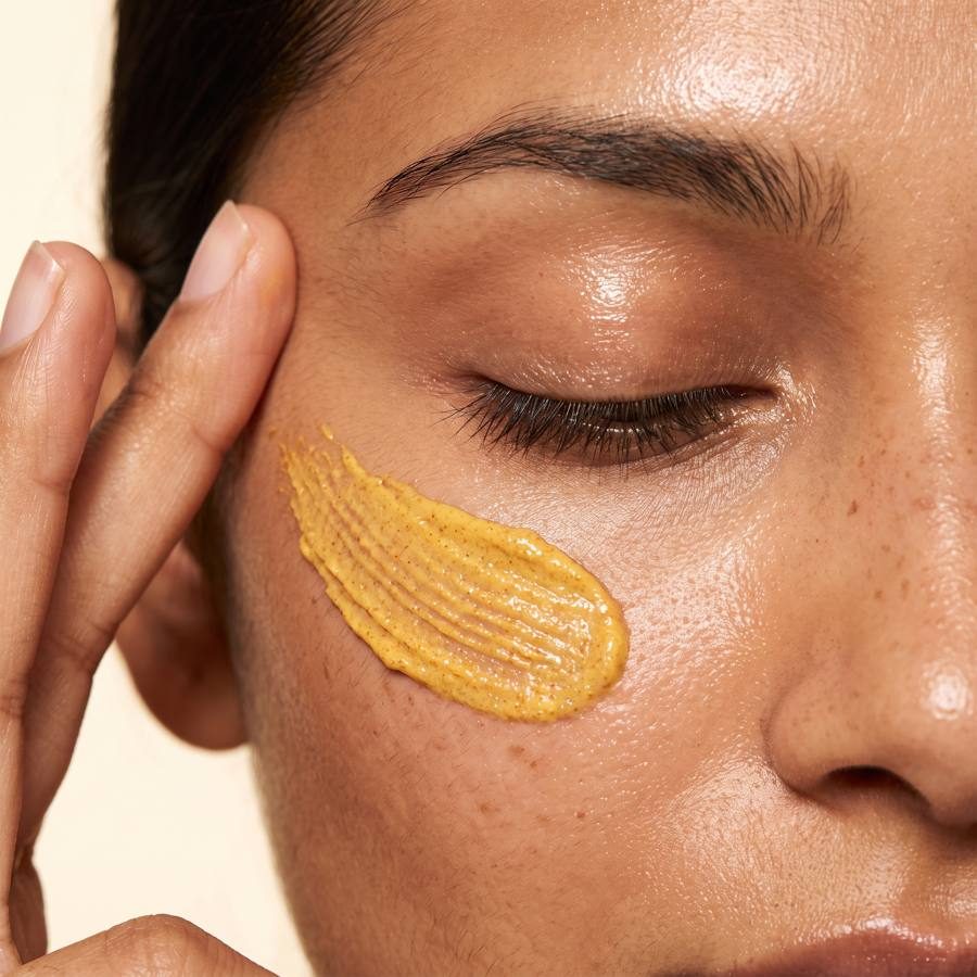 Applying a turmeric curd mask